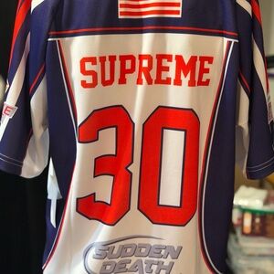 Supreme.                             Purple & Red Striped Sports Football Jersey